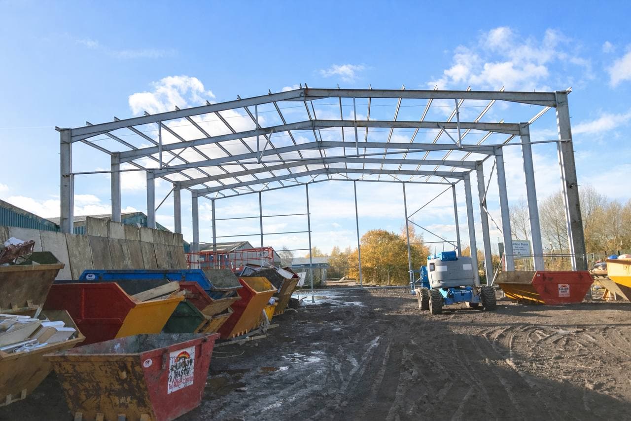 Steel structure framework under construction at dusk